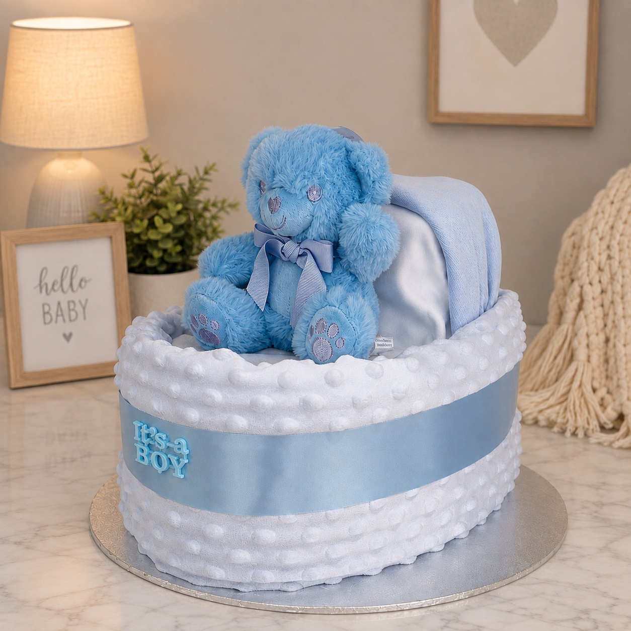 Big blue pram nappy cake with soft blue teddy for a baby boy