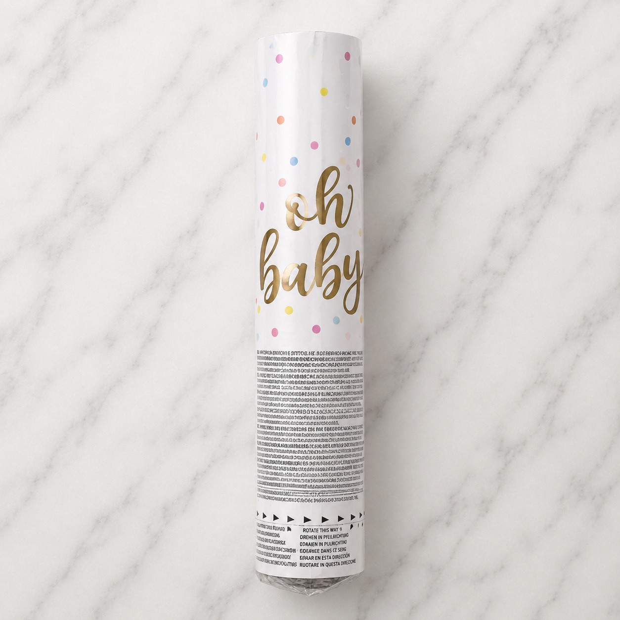 The “oh baby” confetti cannon tube with gold lettering and pastel dots