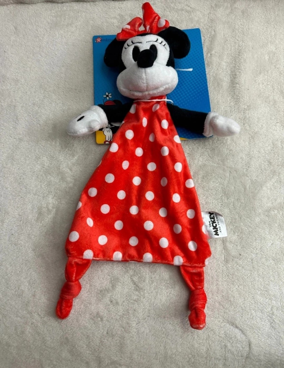 The red-and-white polka-dot Minnie Mouse comforter included with the nappy cake