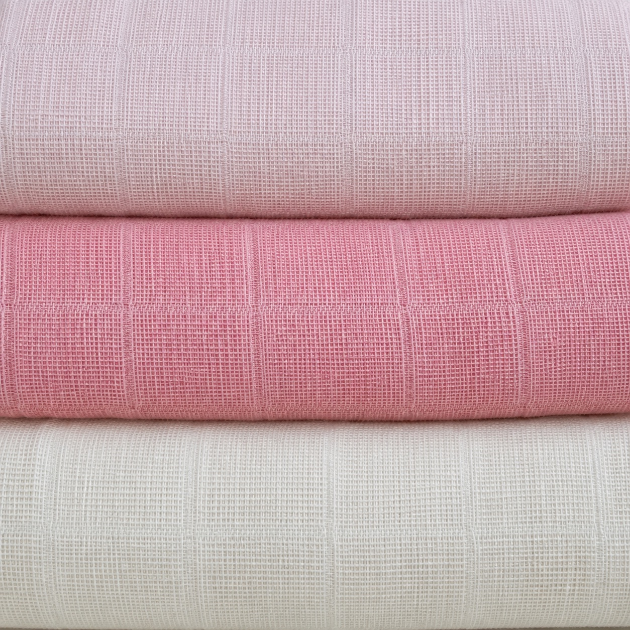 Second view of the rose pink baby muslin square, folded